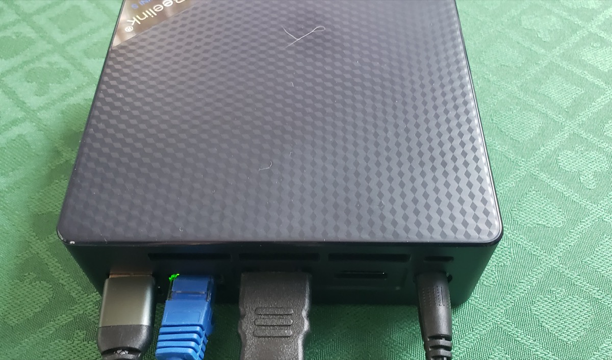 The mini PC wired into the video wall with HDMI and ethernet