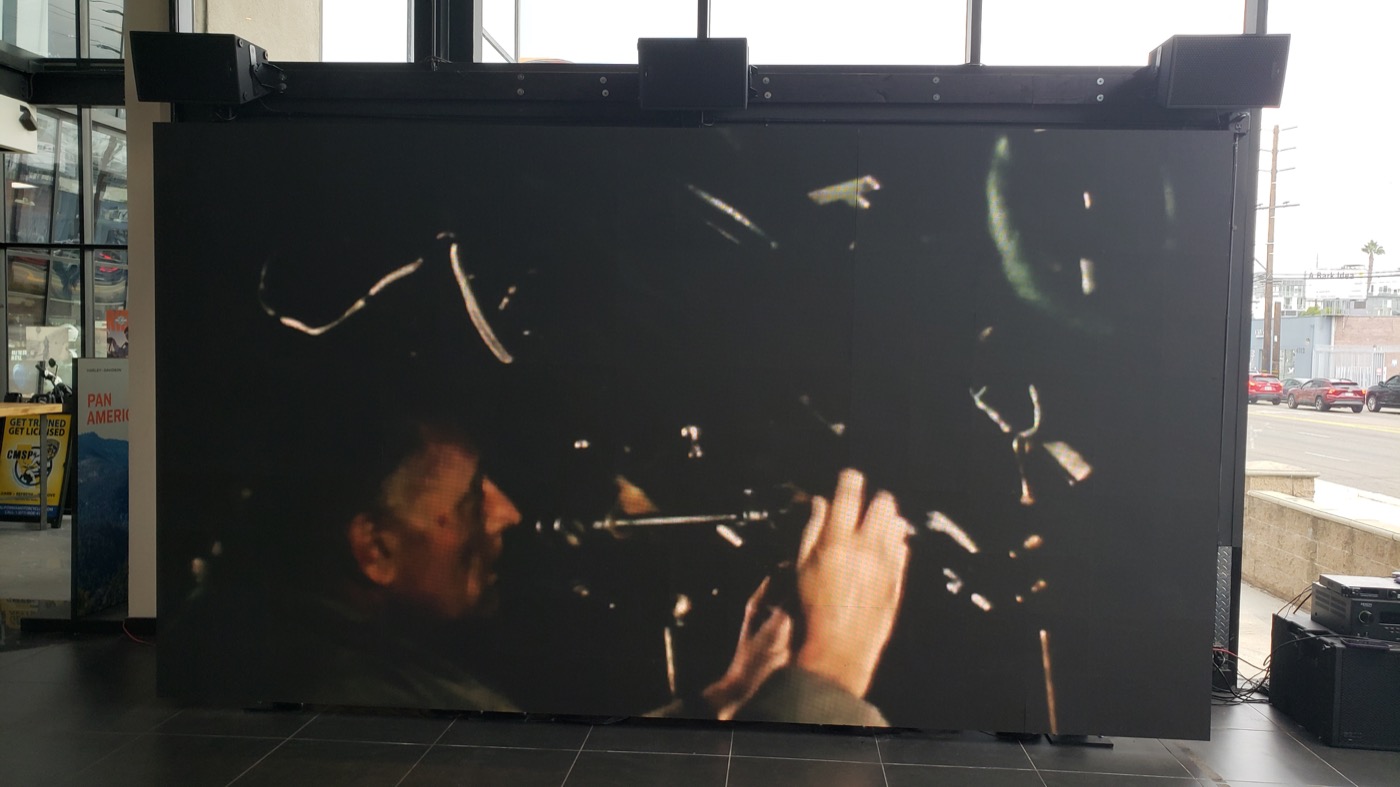 LED video wall showing cinematic content in a dealership showroom
